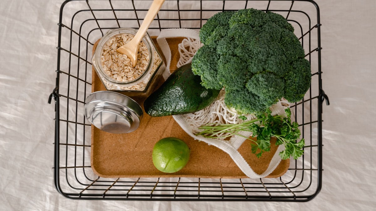 A basket of fresh produce and oats promoting a healthy and sustainable lifestyle.